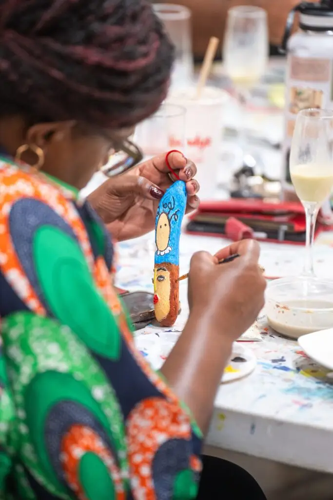 Hand-painting an ornament at the Christmas Fair workshop