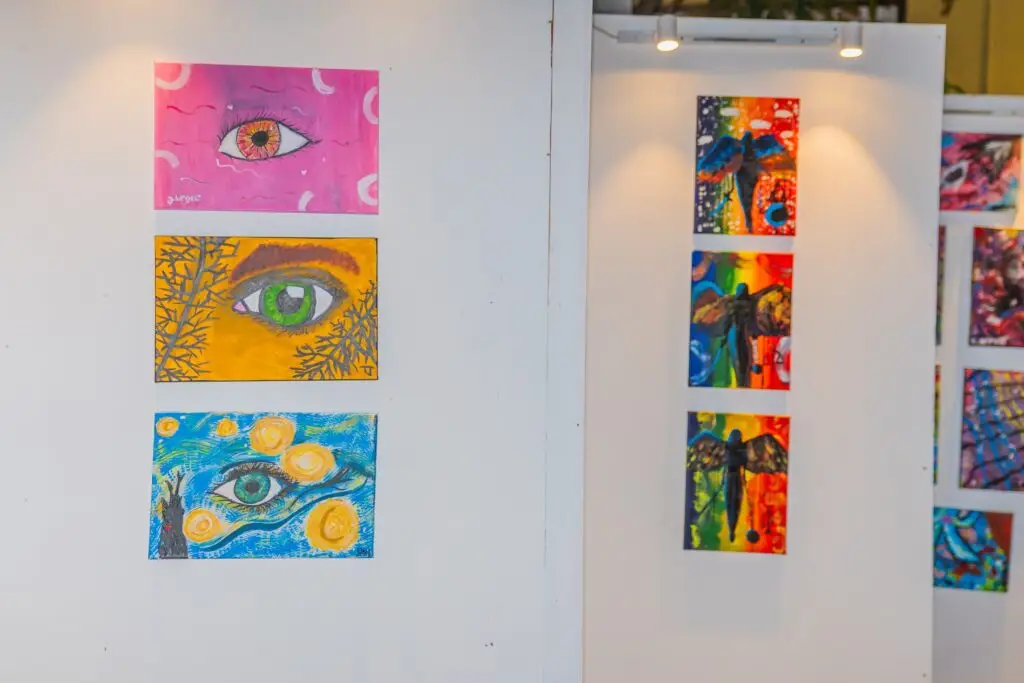 The eye print series hanging on the gallery wall